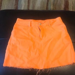 Bright orange denim skirt